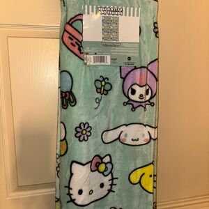 NEW Hello Kitty and Friends Blanket - Greenish/Blue 
Perfect for Easter 🐣